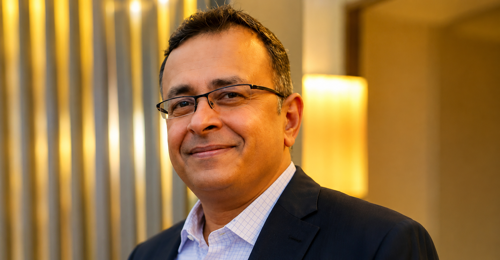 Confident businessman sitting indoors